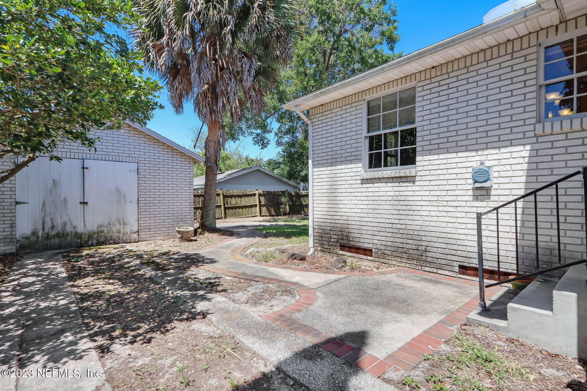 1642 Pershing Road Jacksonville, FL 32205 - Photo 16 of 29 a front view of a house with a yard