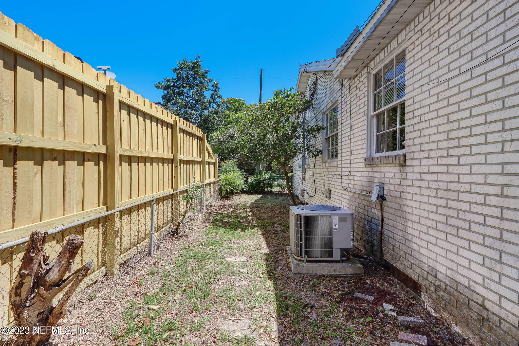 1642 Pershing Road Jacksonville, FL 32205 - Photo 19 of 29 a view of house with wooden floor and a pot