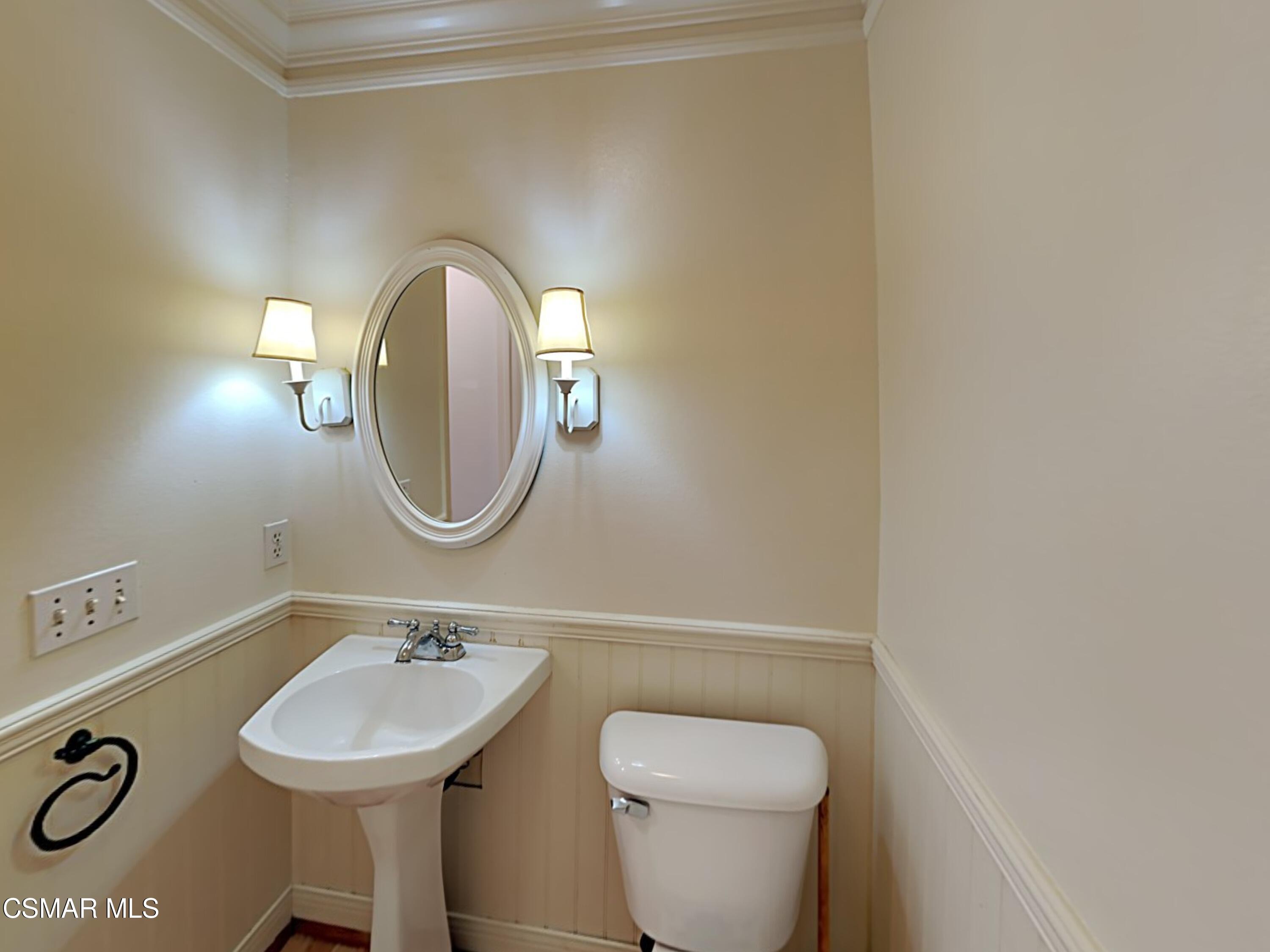 115 Parkside Drive Simi Valley, CA 93065 - Photo 20 of 27 a bathroom with a toilet sink and mirror