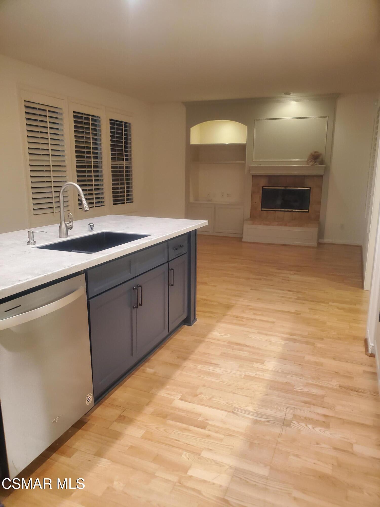 115 Parkside Drive Simi Valley, CA 93065 - Photo 6 of 27 a kitchen with stainless steel appliances granite countertop a sink and a stove