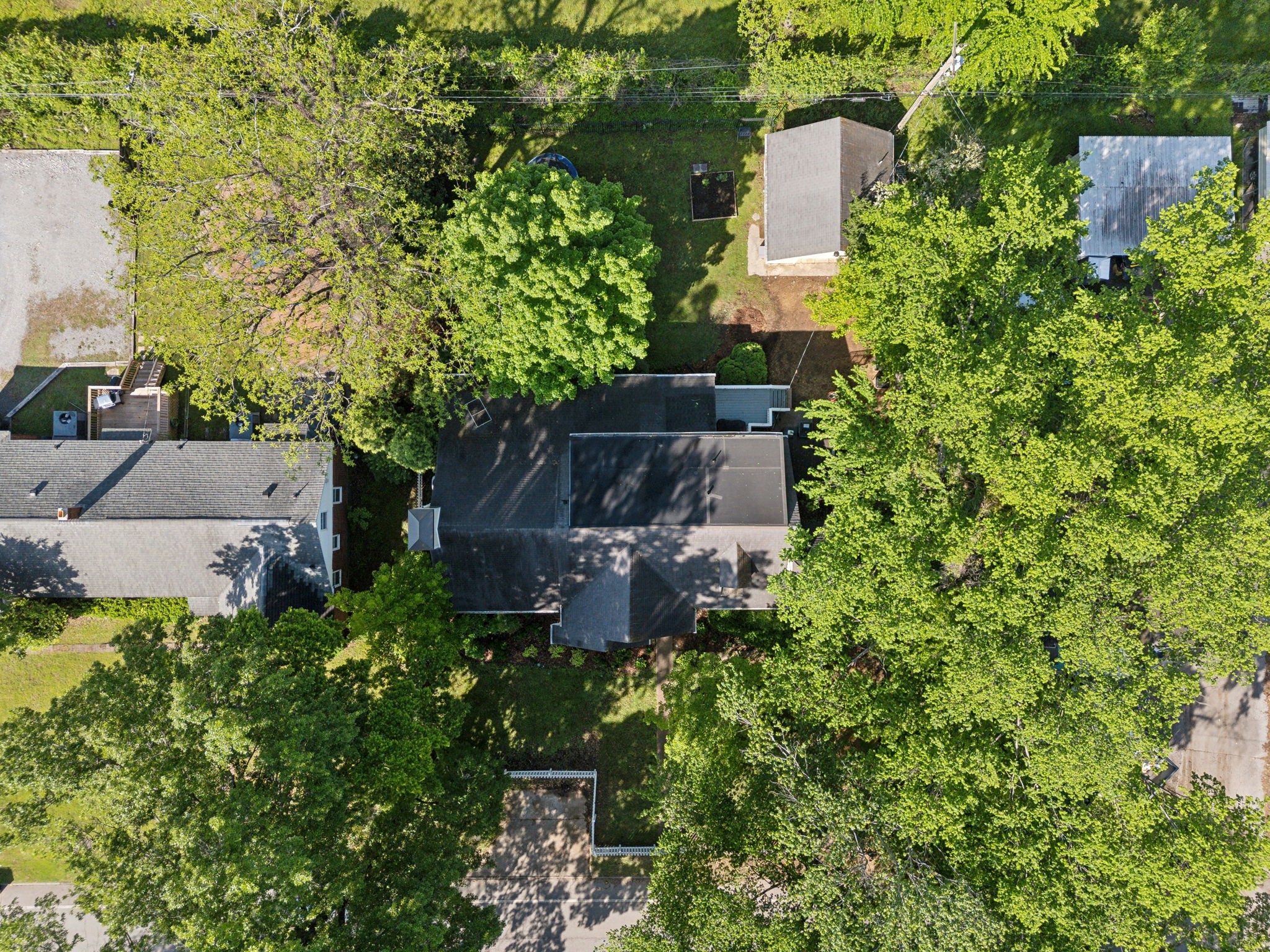 213 Cherokee Road Nashville, TN 37205 - Photo 54 of 54 an aerial view of a house with a yard and large trees