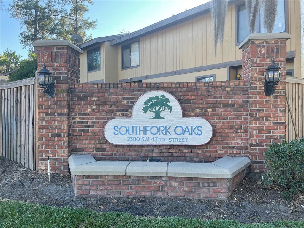 2300 Southwest 43rd Street, Unit F2 Gainesville, FL 32607 - Photo 1 of 1 a view of outdoor space with sign board