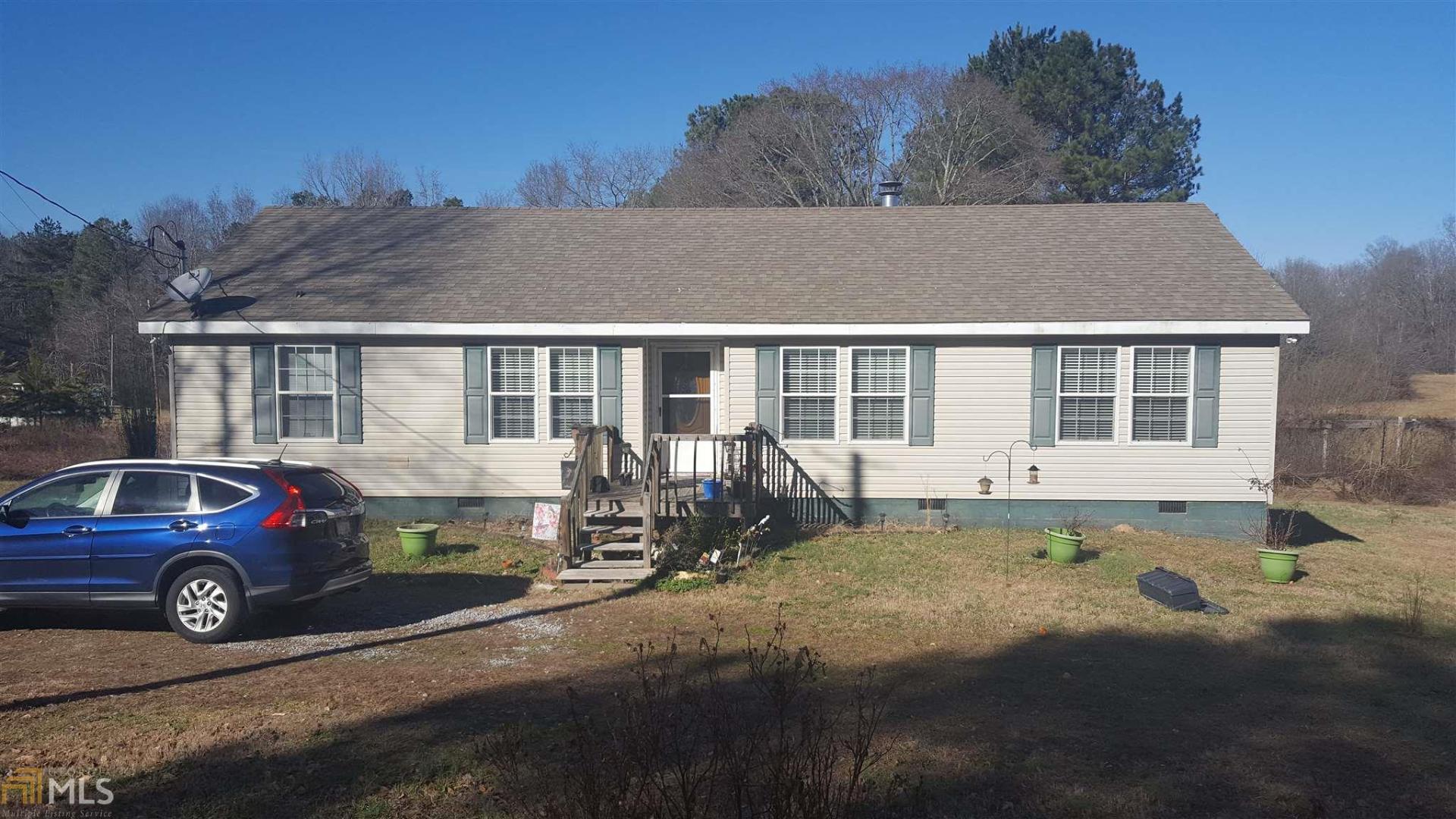 250 Grady Whitton Road Bremen, GA 30110 - Photo 1 of 1 a view of a car park in front of a house