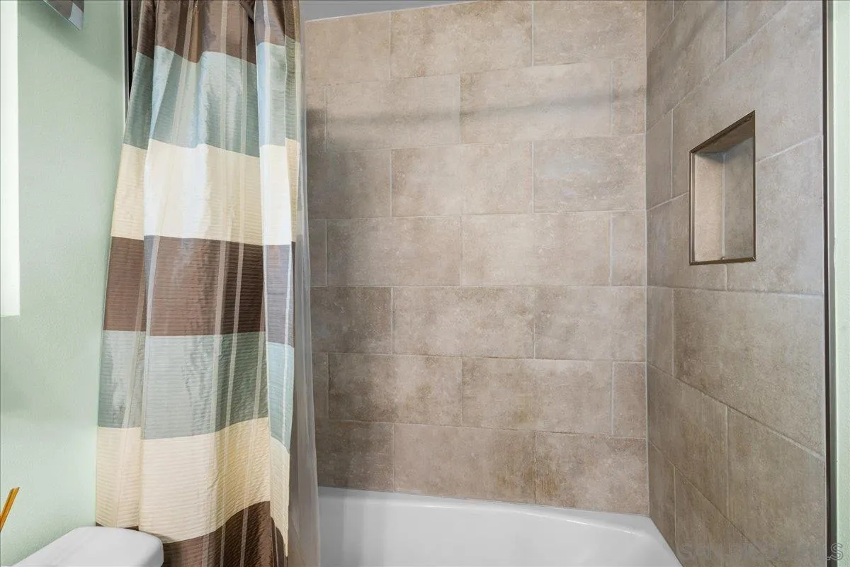 10738 2nd Street Santee, CA 92071 - Photo 19 of 52 a bathroom with a shower and a tub