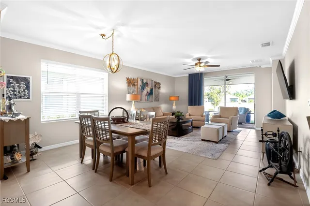 a view of a dining room with furniture window and outside view