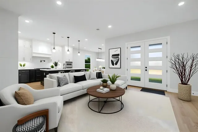 a view of a big room with wooden floor and a ceiling fan