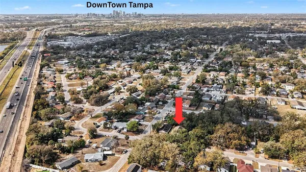 an aerial view of residential houses with outdoor space