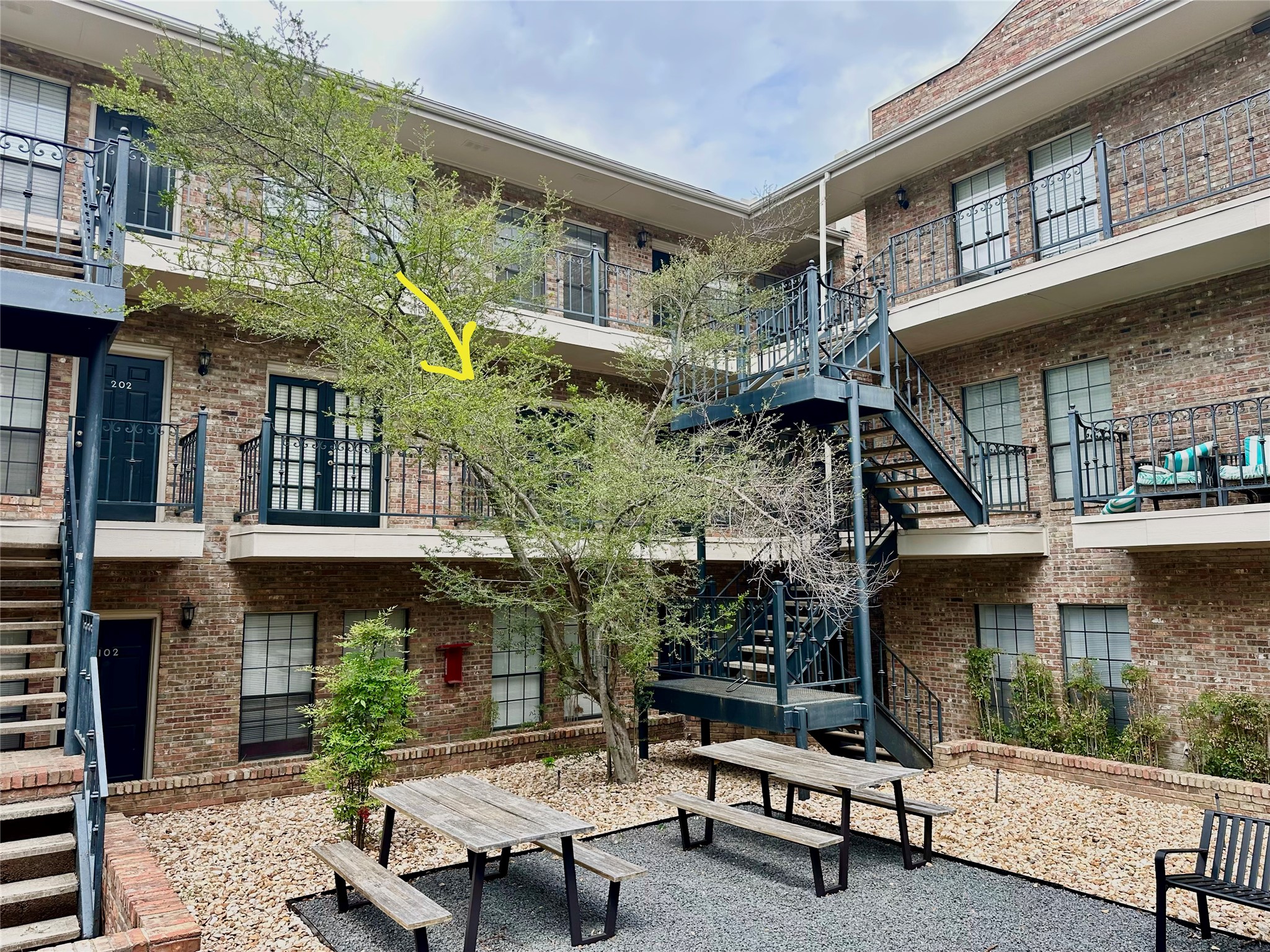 2801 Rio Grande Street, Unit 203 Austin, TX 78705 - Photo 12 of 25 Main feature of the complex is this peaceful courtyard