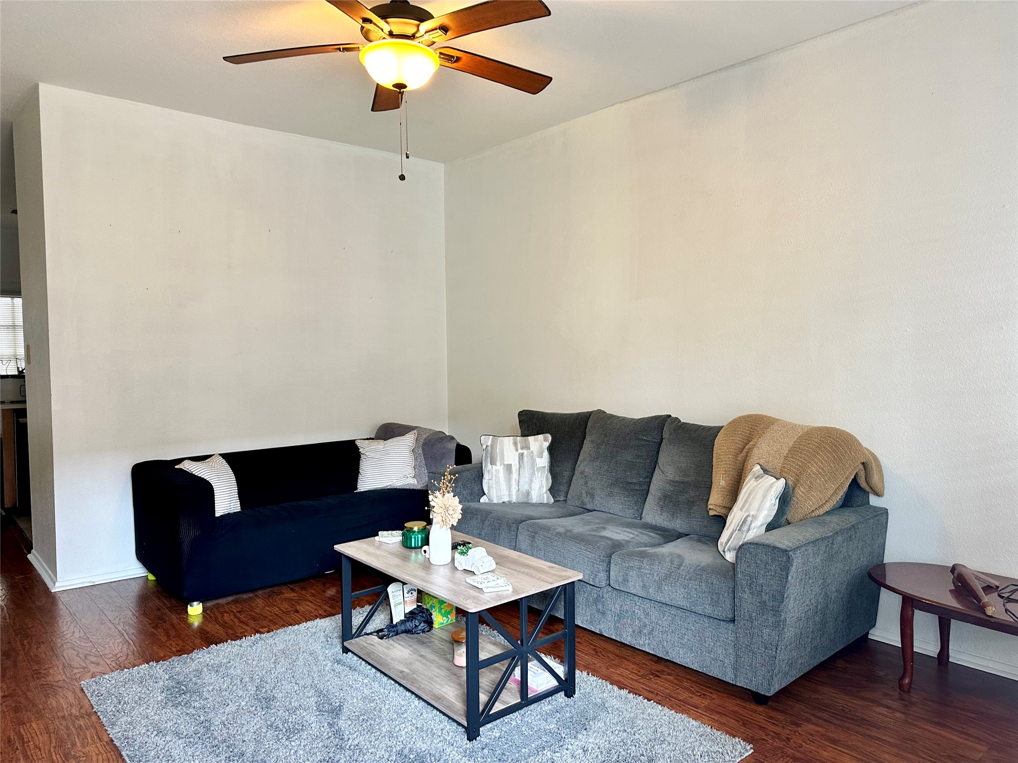 2801 Rio Grande Street, Unit 203 Austin, TX 78705 - Photo 14 of 25 The black couch can convey