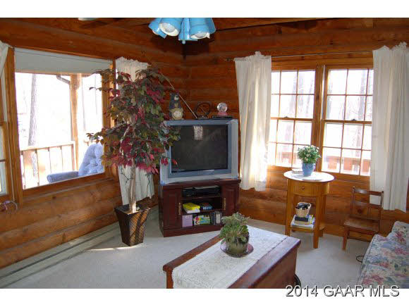 844 Barnhart Road Fort Defiance, VA 24437 - Photo 7 of 25 a living room with furniture a window and a fireplace
