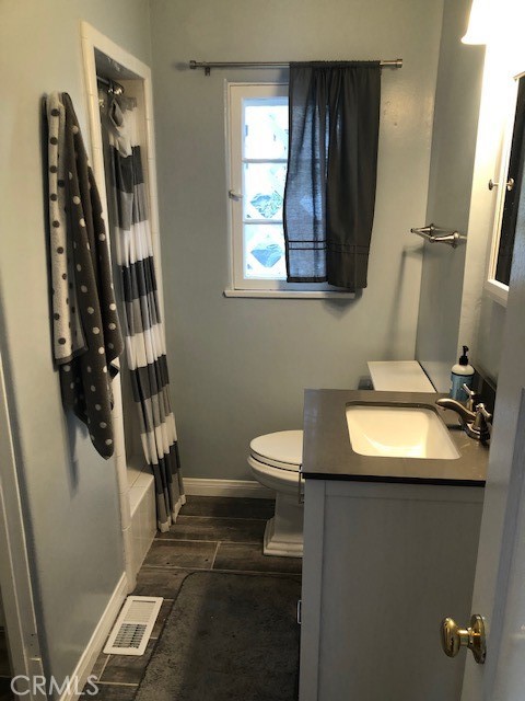 640 Cuprien Way Laguna Beach, CA 92651 - Photo 14 of 18 a bathroom with a sink toilet and mirror