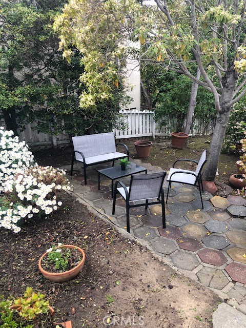 640 Cuprien Way Laguna Beach, CA 92651 - Photo 16 of 18 a wooden bench sitting in the backyard of a house