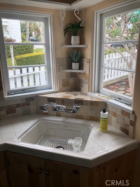 640 Cuprien Way Laguna Beach, CA 92651 - Photo 6 of 18 a kitchen with a sink appliances and a window