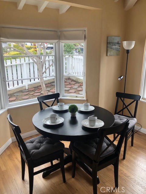 640 Cuprien Way Laguna Beach, CA 92651 - Photo 8 of 18 a view of a dining room with furniture and wooden floor