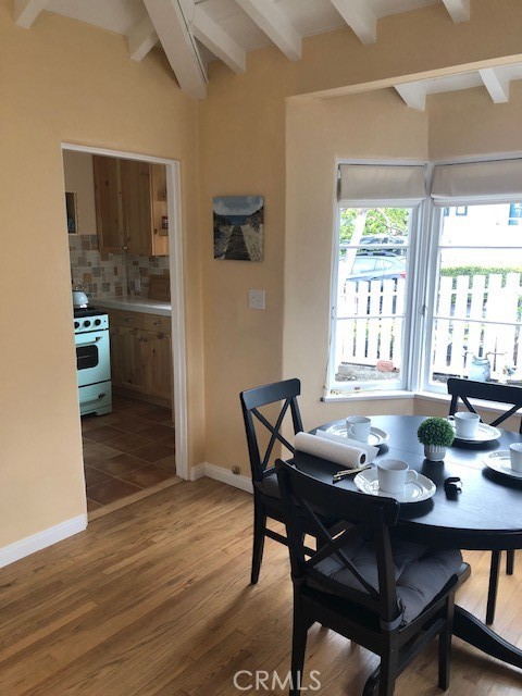 640 Cuprien Way Laguna Beach, CA 92651 - Photo 10 of 18 a view of a dining room with furniture and wooden floor