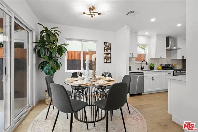 a dining room with furniture and window