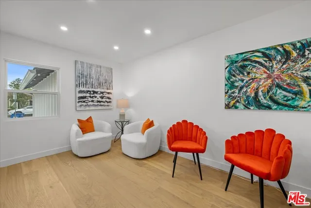 a living room with furniture and a lamp