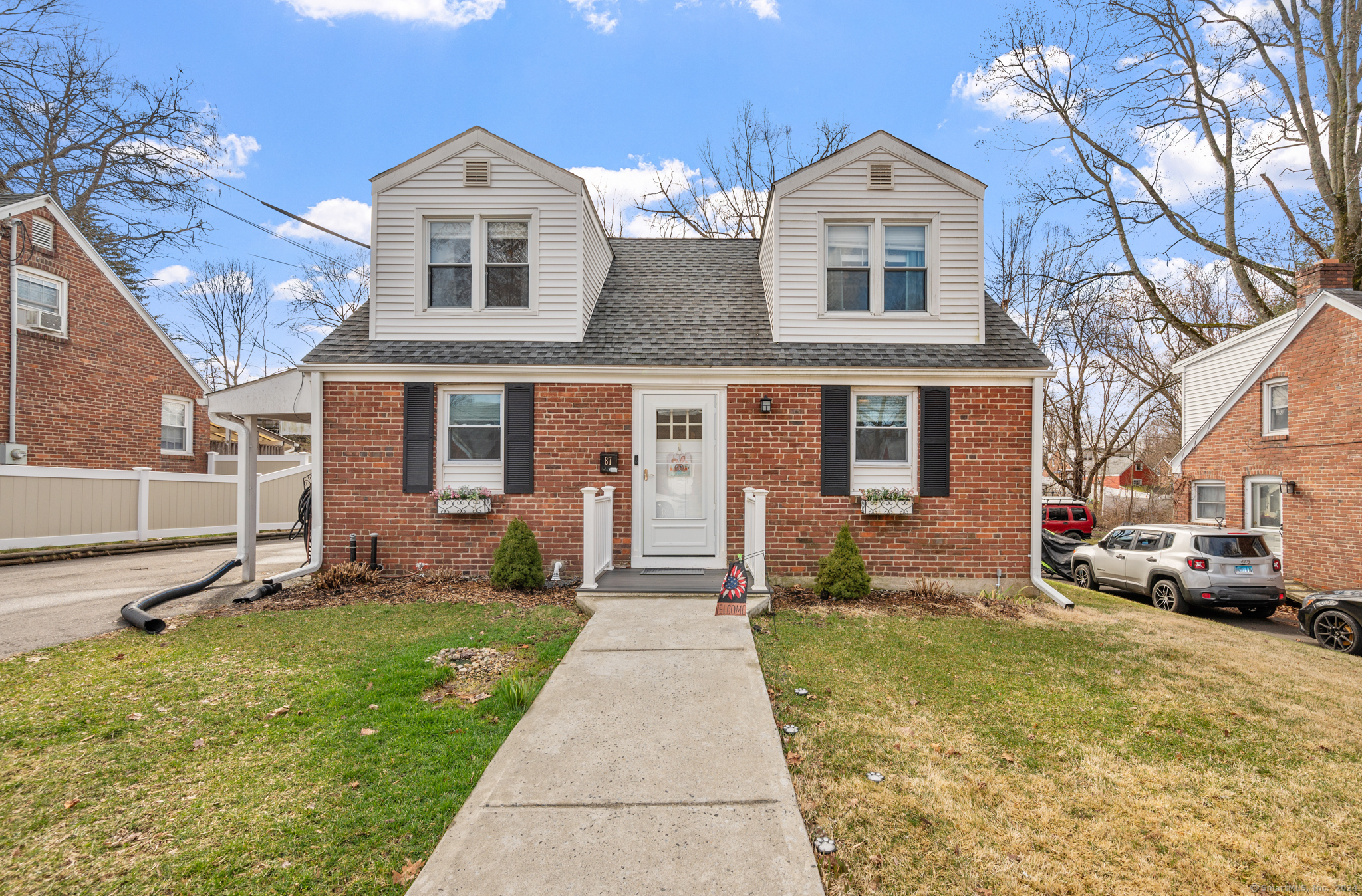 a front view of a house with a yard