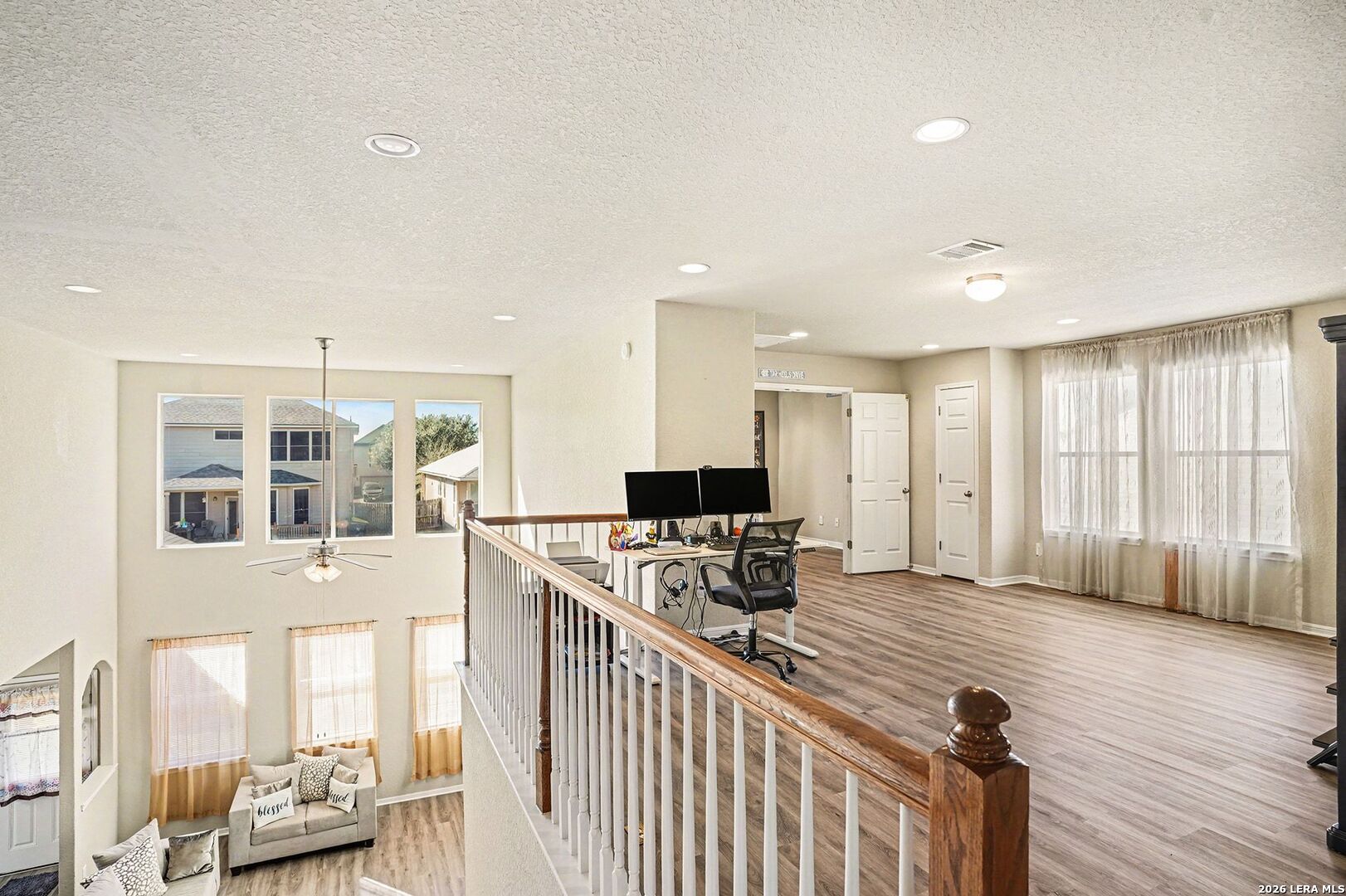 213 Wildcat Cibolo, TX 78108 - Photo 20 of 35 a kitchen with stainless steel appliances granite countertop a stove and a refrigerator