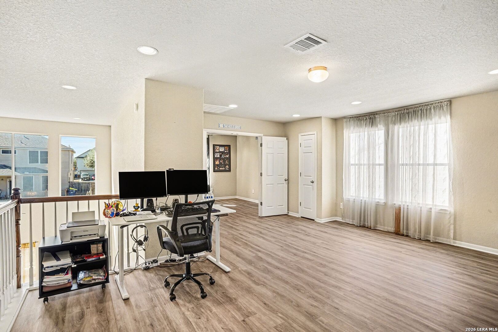 213 Wildcat Cibolo, TX 78108 - Photo 21 of 35 a view of a workspace with furniture and a window