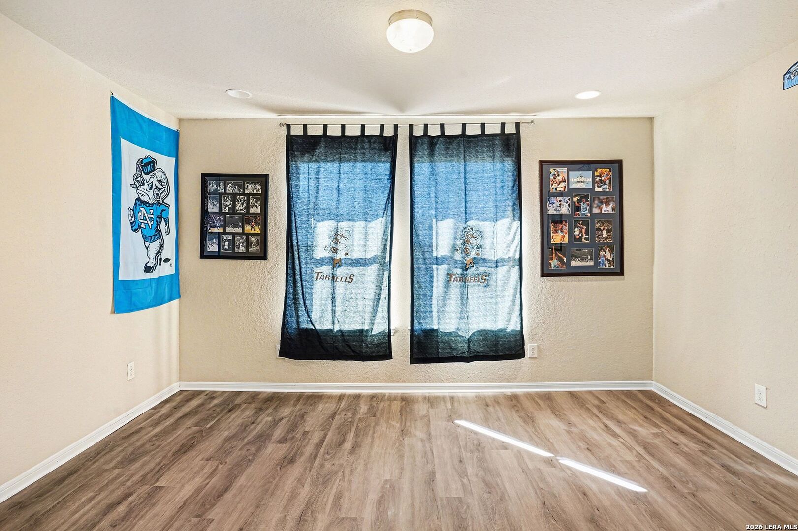 213 Wildcat Cibolo, TX 78108 - Photo 23 of 35 a view of an empty room with wooden floor and a window