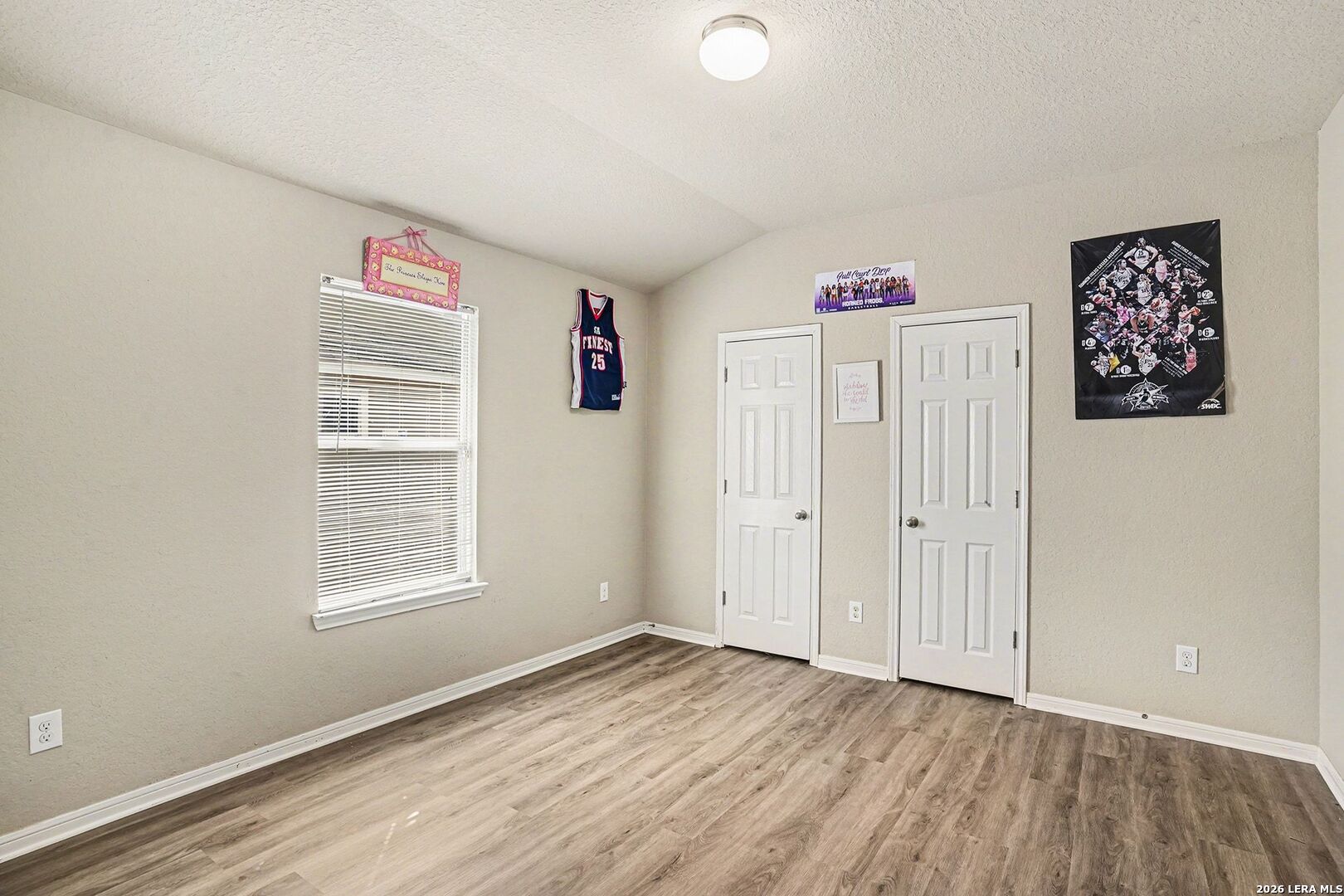 213 Wildcat Cibolo, TX 78108 - Photo 25 of 35 a view of an empty room with wooden floor and a window