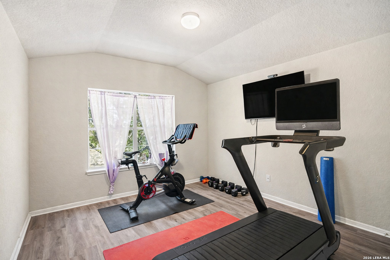 213 Wildcat Cibolo, TX 78108 - Photo 26 of 35 a view of a workspace with furniture and a flat screen tv
