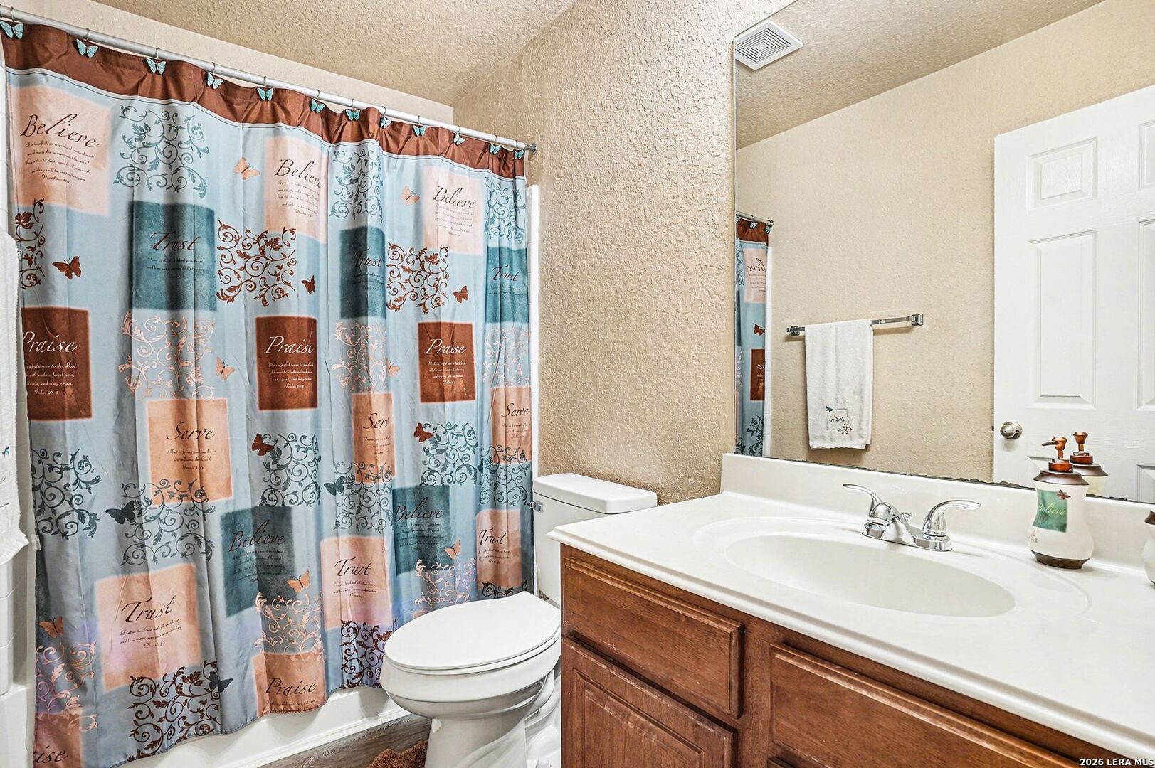213 Wildcat Cibolo, TX 78108 - Photo 29 of 35 a bathroom with a sink a toilet and shower