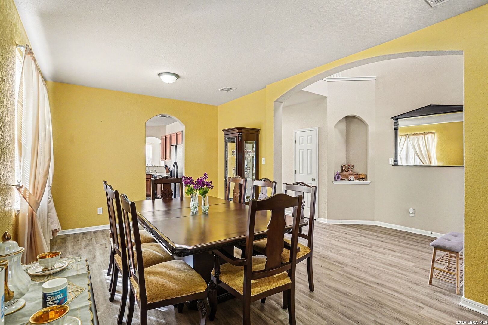 213 Wildcat Cibolo, TX 78108 - Photo 7 of 35 a view of a dining room with furniture and wooden floor