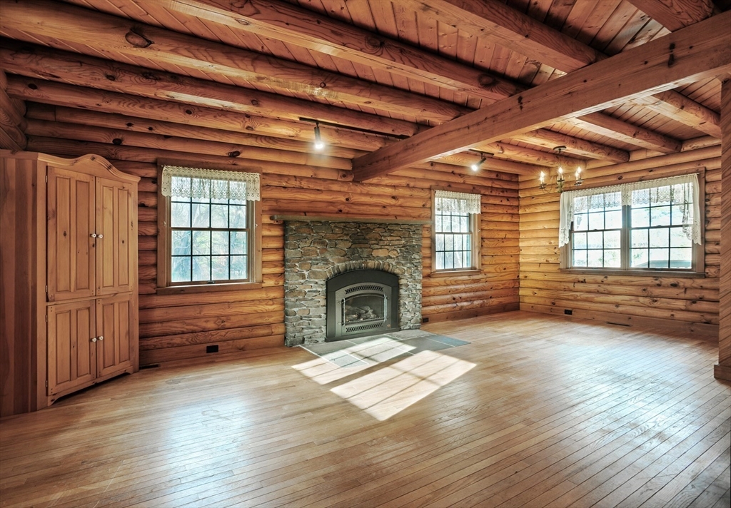 134 Crescent Street Hanson, MA 02341 - Photo 16 of 31 a view of livingroom with fireplace and window