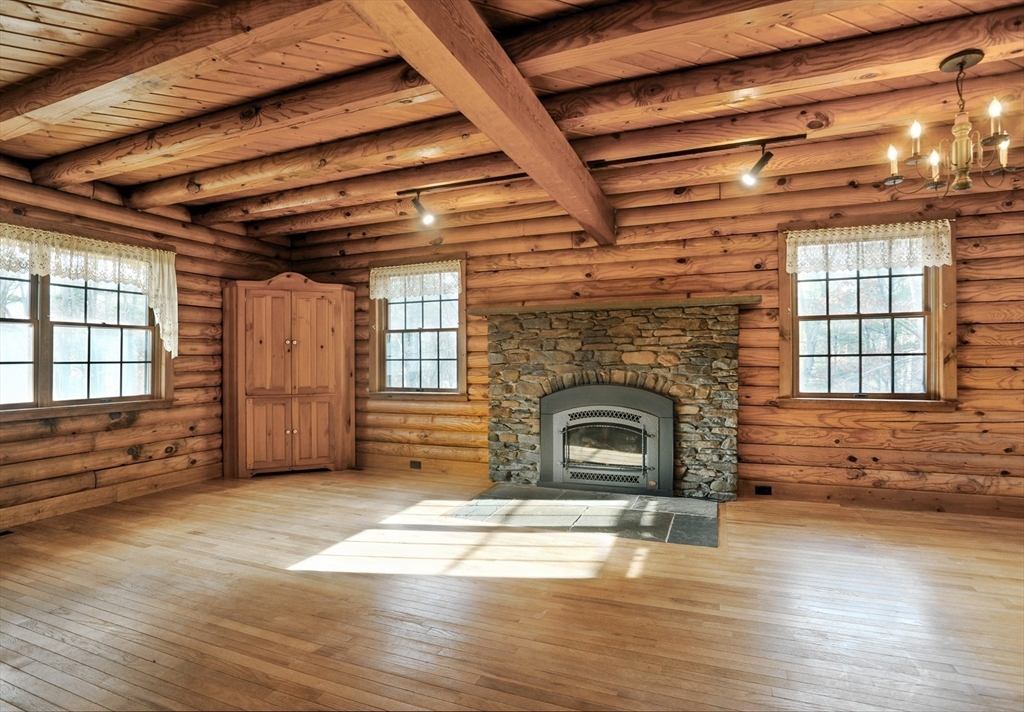134 Crescent Street Hanson, MA 02341 - Photo 17 of 31 a view of livingroom with fireplace and window