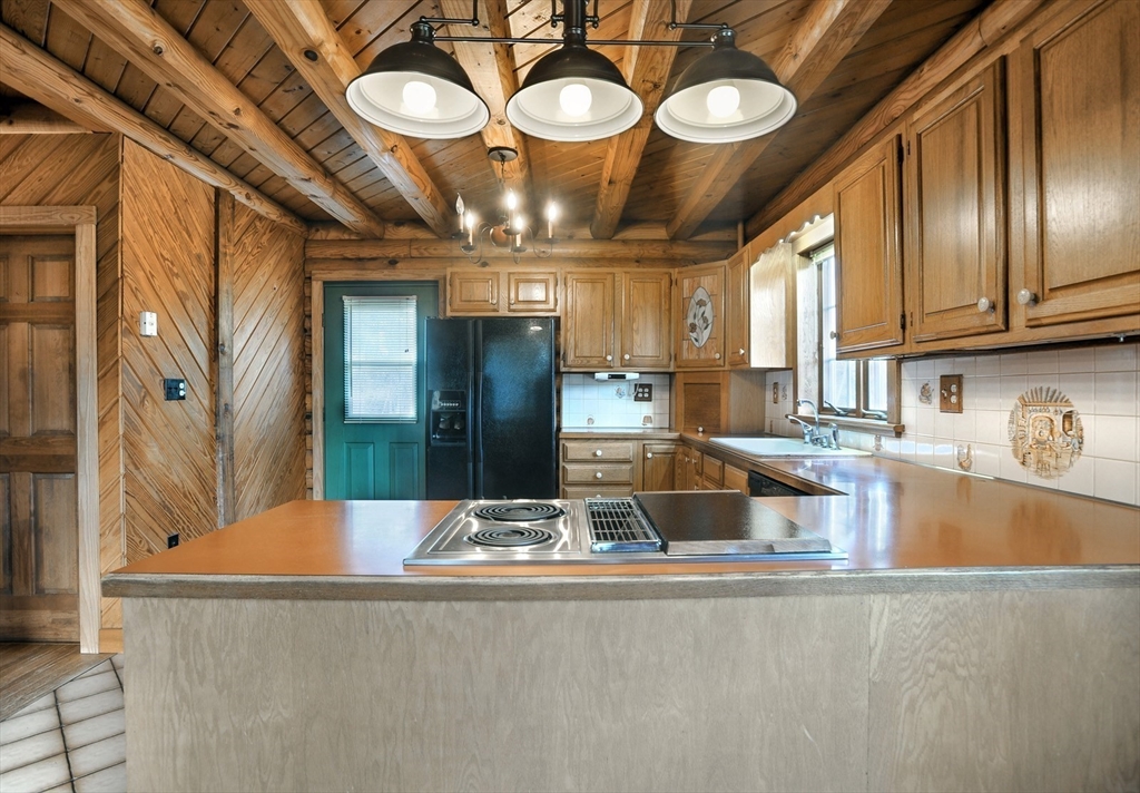 134 Crescent Street Hanson, MA 02341 - Photo 21 of 31 a view of a kitchen with a refrigerator and a sink