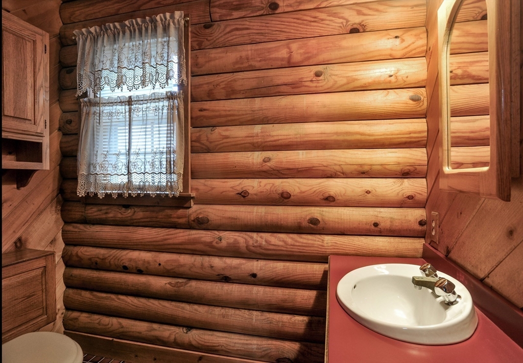 134 Crescent Street Hanson, MA 02341 - Photo 24 of 31 a bathroom with a toilet bathtub and windows