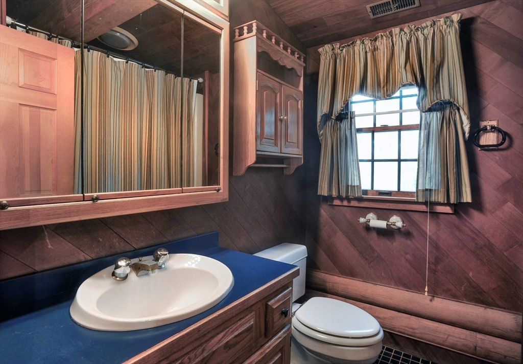 134 Crescent Street Hanson, MA 02341 - Photo 27 of 31 a bathroom with a sink toilet mirror and tub