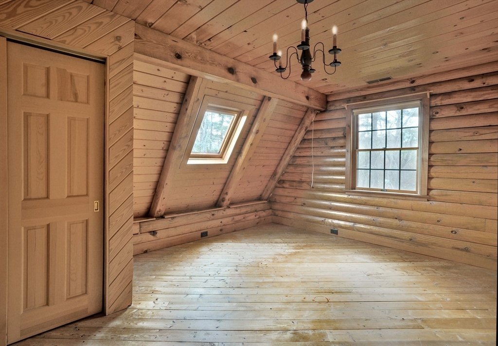 134 Crescent Street Hanson, MA 02341 - Photo 28 of 31 a view of an empty room with a window