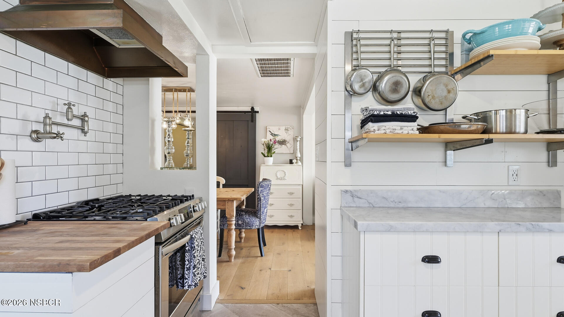 545 Perkins Street Los Alamos, CA 93440 - Photo 12 of 49 a kitchen with a stove and a cabinets