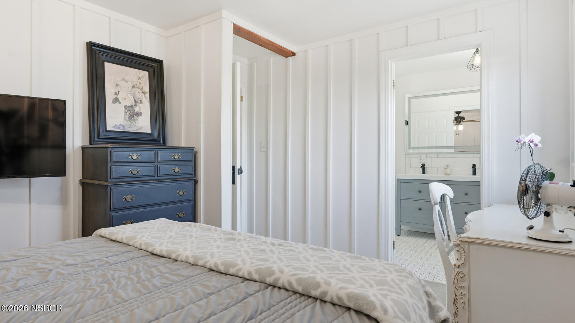 545 Perkins Street Los Alamos, CA 93440 - Photo 18 of 49 a bedroom with a bed and a television