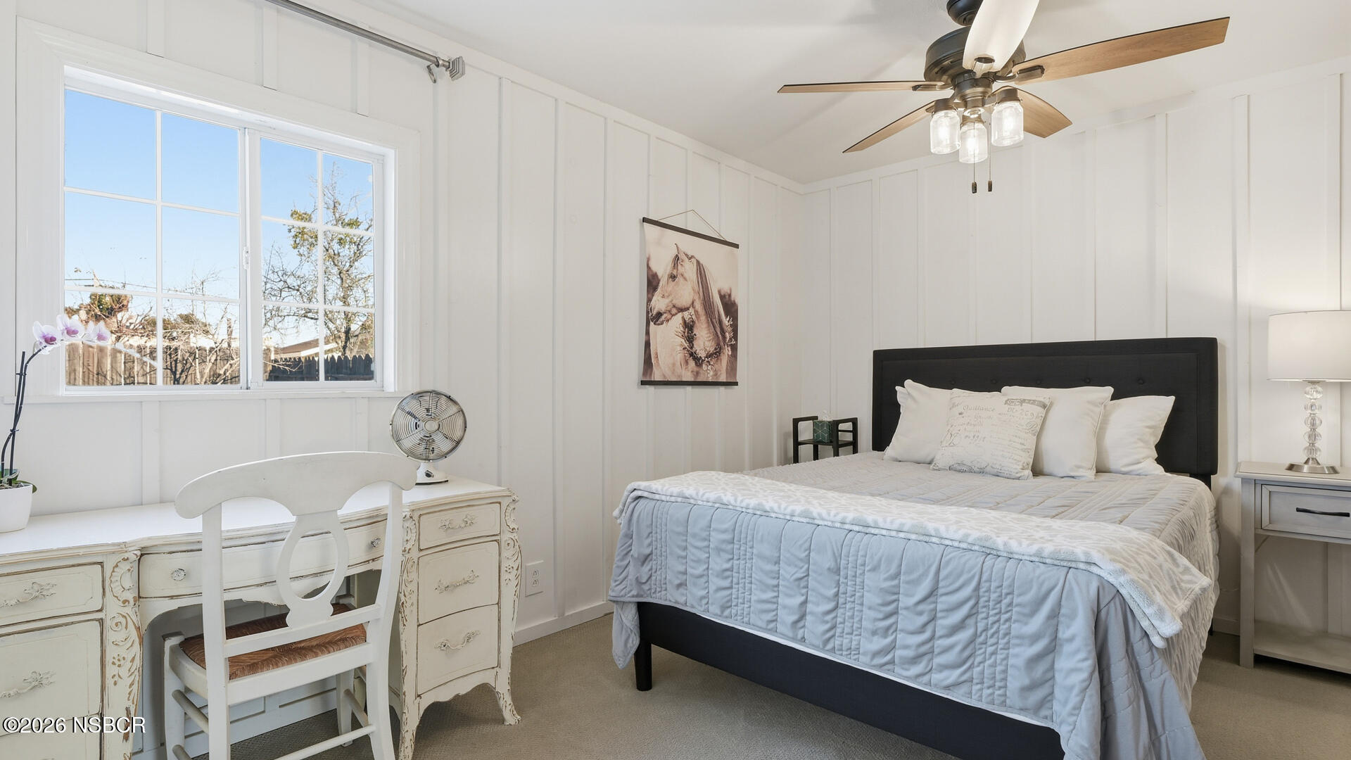 545 Perkins Street Los Alamos, CA 93440 - Photo 20 of 49 a bedroom with a bed a dresser and chair