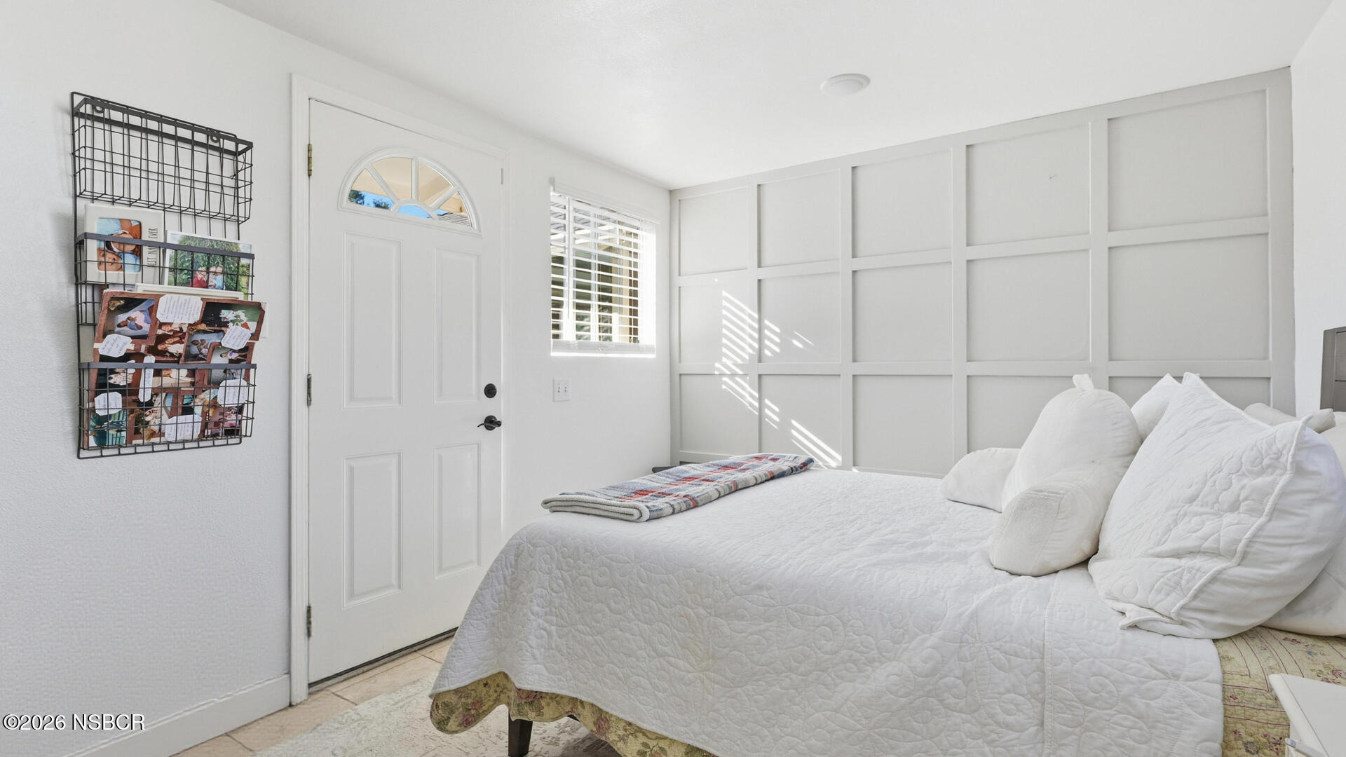 545 Perkins Street Los Alamos, CA 93440 - Photo 28 of 49 a bedroom with a bed and a window