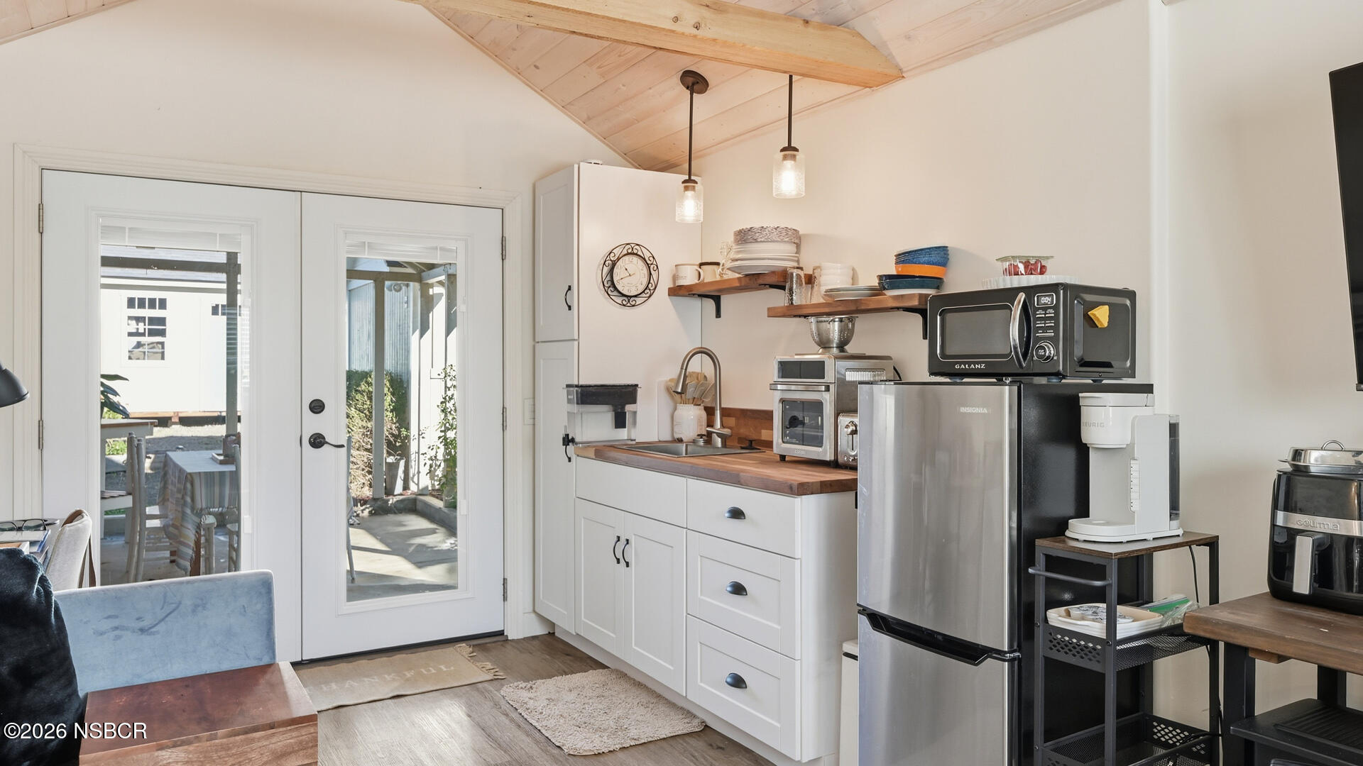 545 Perkins Street Los Alamos, CA 93440 - Photo 35 of 49 a kitchen with stainless steel appliances granite countertop a refrigerator and a stove top oven