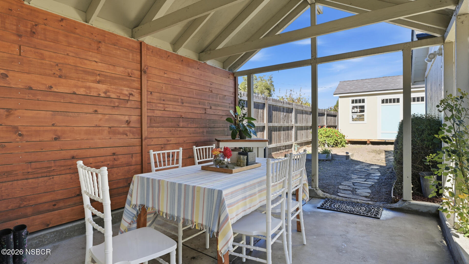 545 Perkins Street Los Alamos, CA 93440 - Photo 42 of 49 a view of a patio with table and chairs and potted plants
