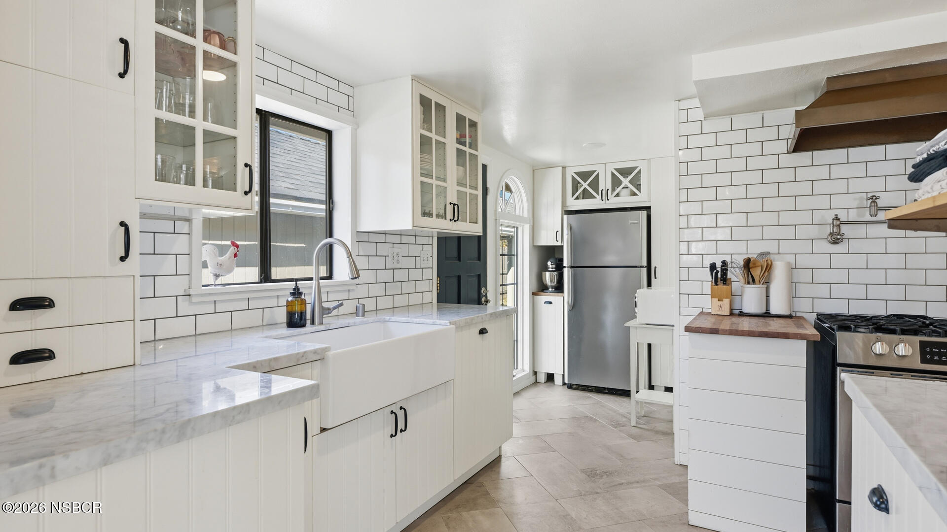 545 Perkins Street Los Alamos, CA 93440 - Photo 10 of 49 a kitchen with a refrigerator and a sink