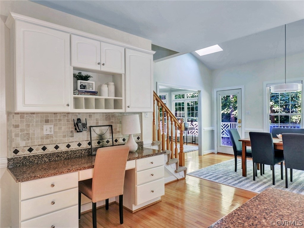 1930 Corner Rock Road Midlothian, VA 23113 - Photo 12 of 37 a living room with stainless steel appliances kitchen island granite countertop a table chairs and a view of living room