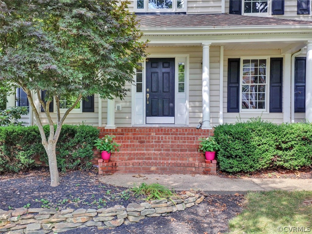 1930 Corner Rock Road Midlothian, VA 23113 - Photo 2 of 37 a front view of a house with a yard