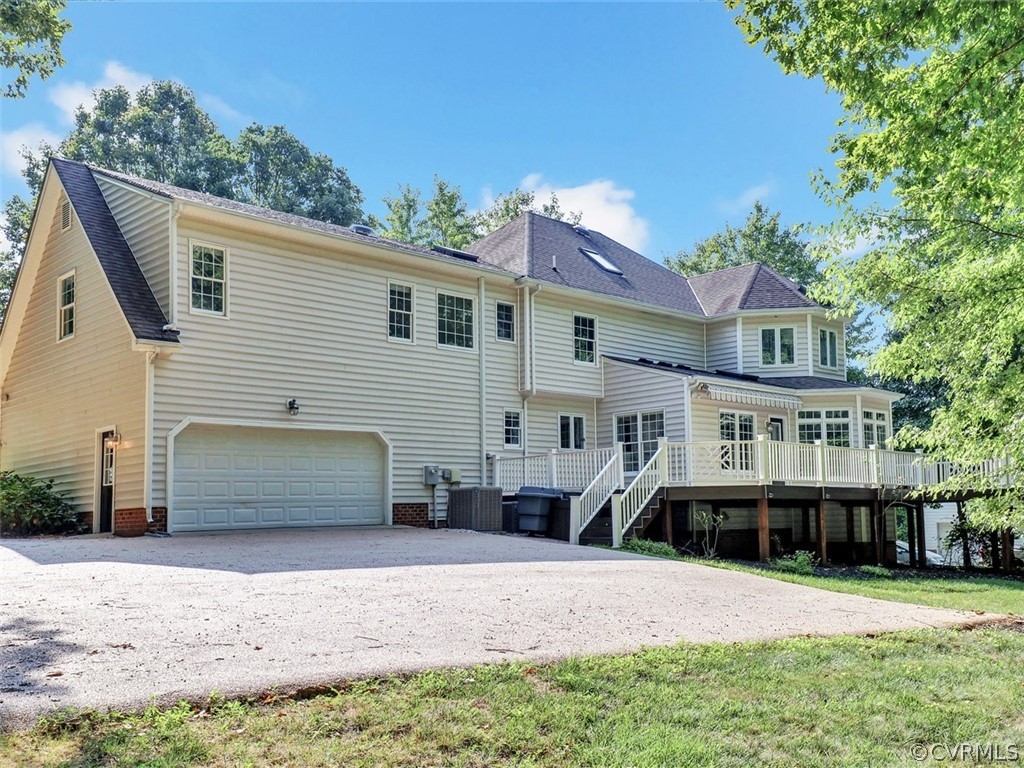 1930 Corner Rock Road Midlothian, VA 23113 - Photo 36 of 37 a front view of a house with a yard and garage