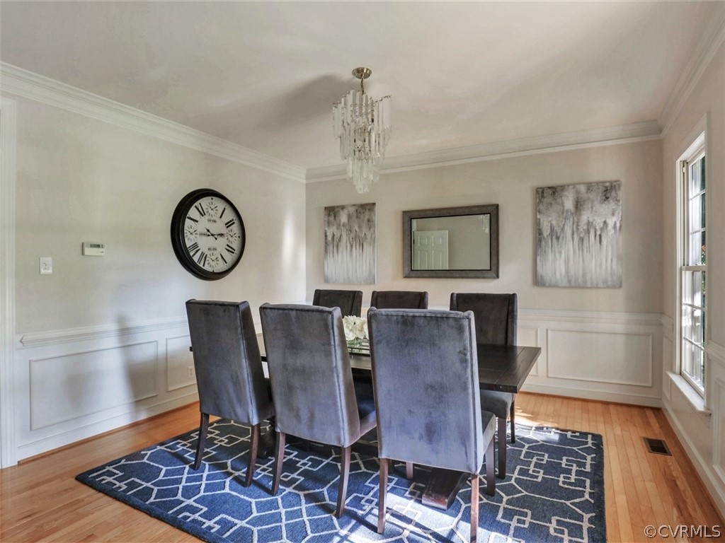 1930 Corner Rock Road Midlothian, VA 23113 - Photo 6 of 37 a view of a dining room with furniture window and wooden floor