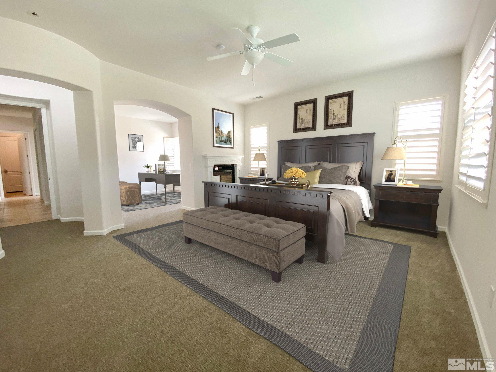 2700 Trail Rider Drive Reno, NV 89521 - Photo 8 of 29 a spacious bedroom with a large bed and a chandelier