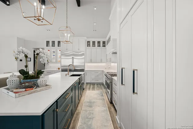 a kitchen with counter top space and appliances