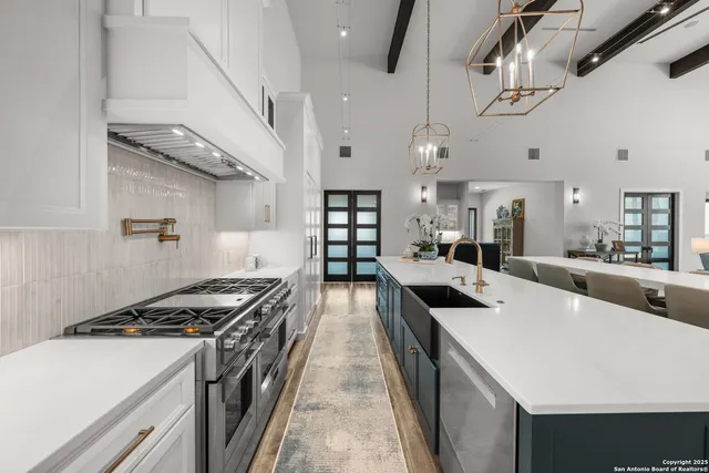 a kitchen with stove and refrigerator