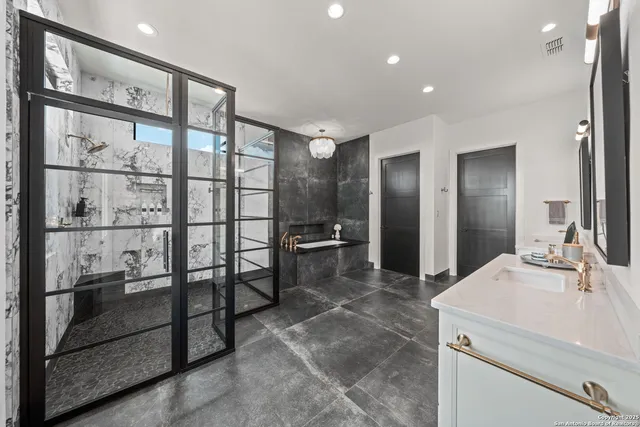 a bathroom with a shower and a sink